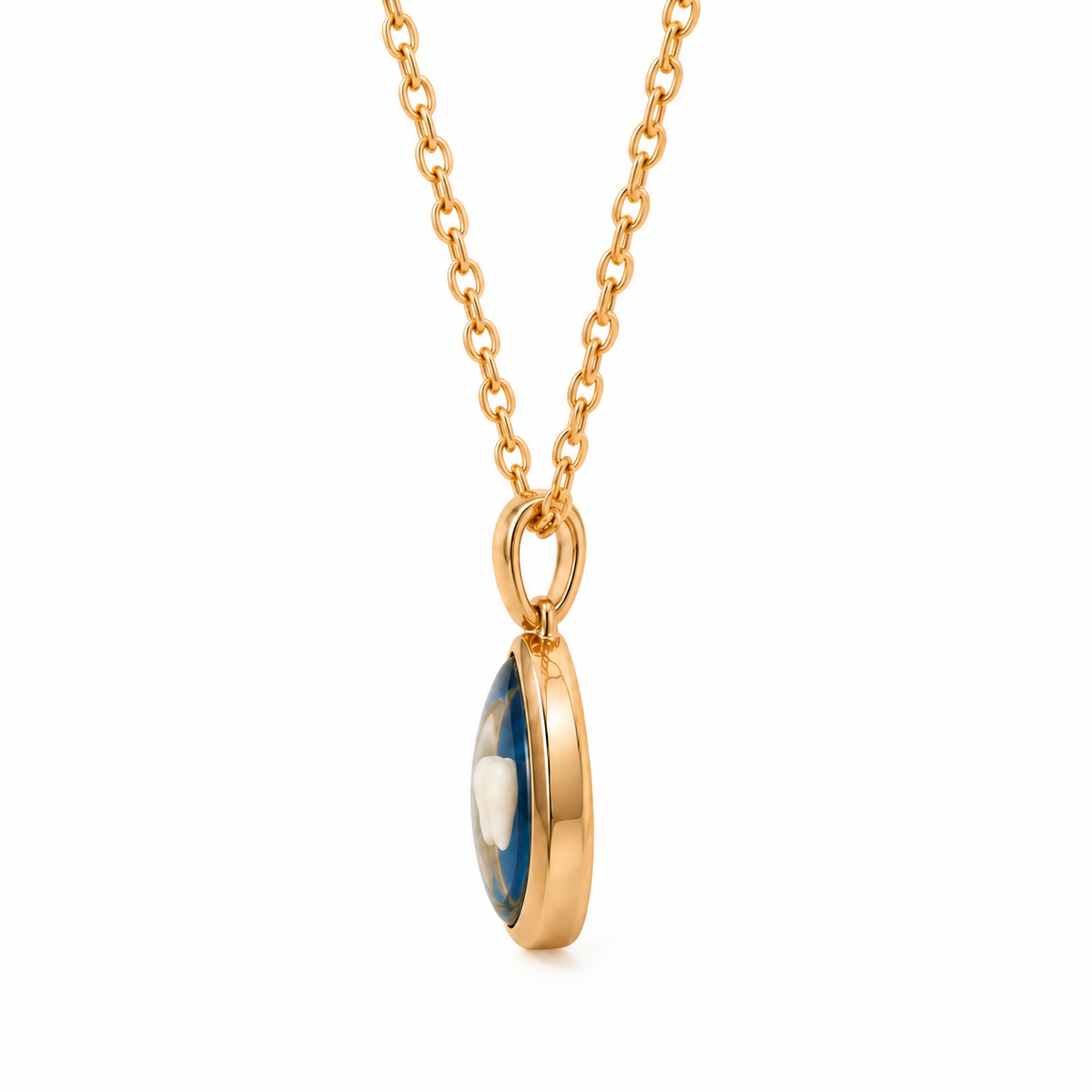 A gold chain necklace with an oval pendant featuring a polished gold bezel and a blue-and-white marbled center, shown on a plain white background.
