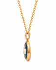 A gold chain necklace with an oval pendant featuring a polished gold bezel and a blue-and-white marbled center, shown on a plain white background.