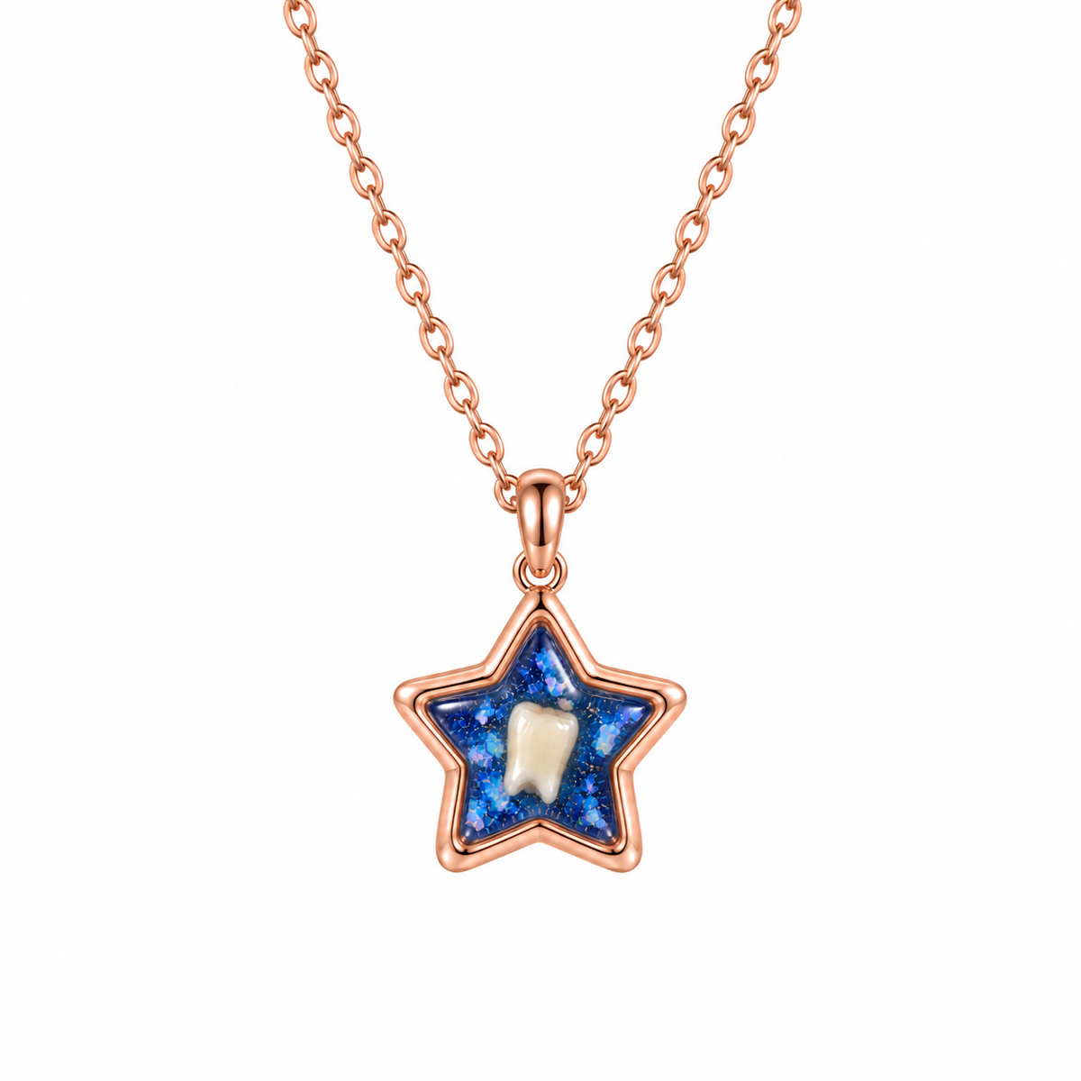 Rose gold star-shaped baby tooth keepsake necklace with a whole tooth preserved in a deep blue resin stone.