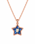 Rose gold star-shaped baby tooth keepsake necklace with a whole tooth preserved in a deep blue resin stone.