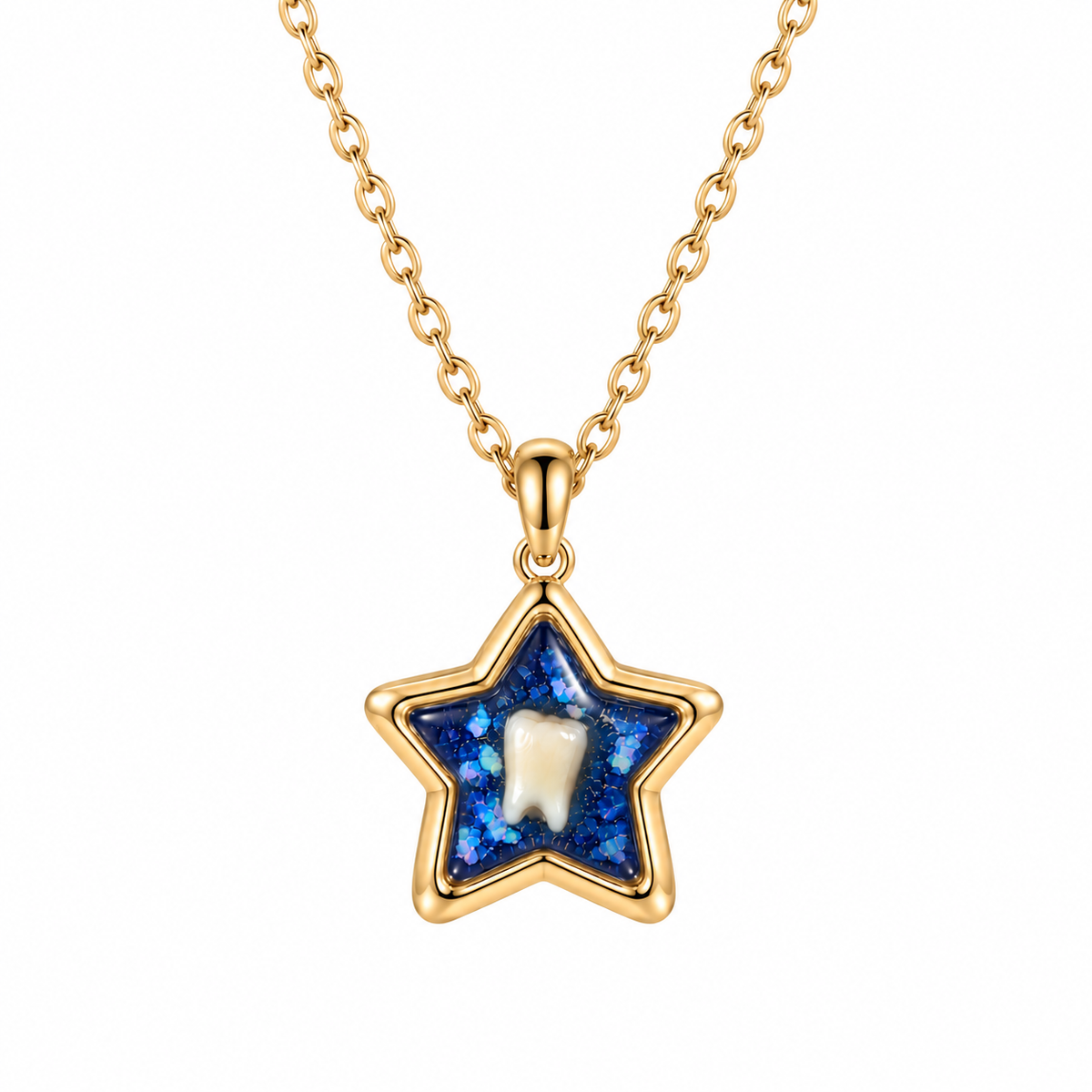 A gold star-shaped pendant necklace featuring a textured blue glittery inlay and a central white tooth charm, suspended from a gold chain on a white background.